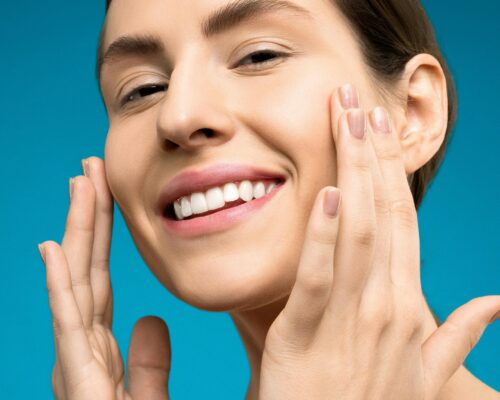 Woman smoothing fine lines away with her hands