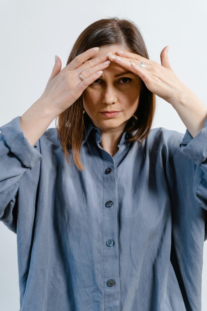 Woman thinking about choosing between Skin Tightening vs. Facelift